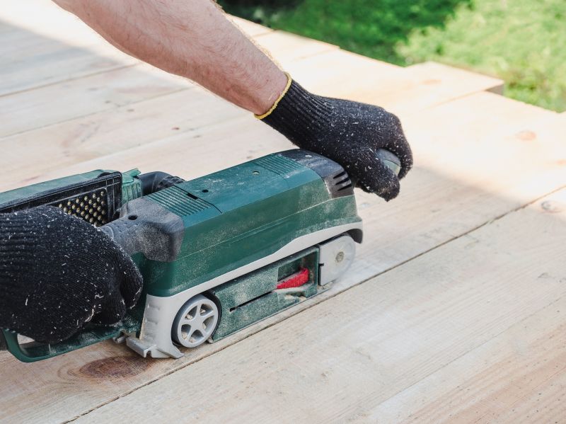 Deck sanding equipment in use